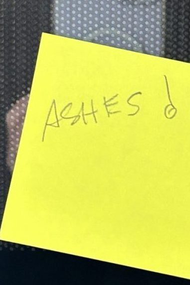 yellow sticky note with the word ashes written on it